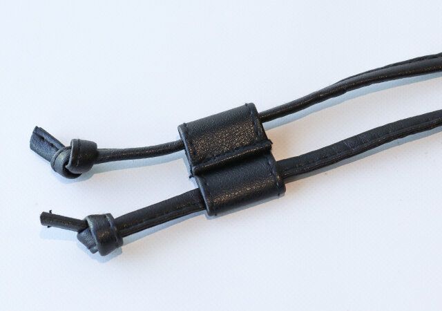 コンジェ ぺイエ アデュー トリステスの2way巾着バッグのストラップ