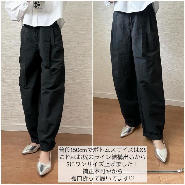 ブラックのテックタックコクーンパンツを着用している
