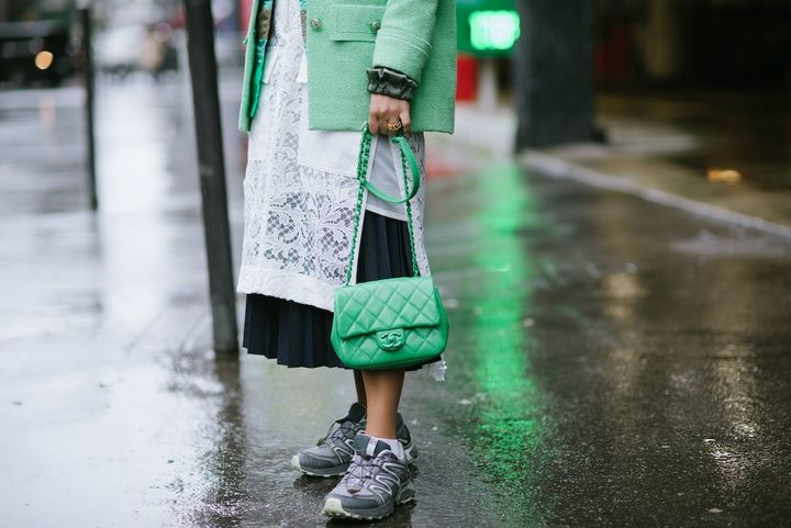 PARIS, FRANCE - MARCH 02_ A guest poses wearing Sacai, a Chanel bag and Salomon trail shoes after the Sacai show during Paris Fashion Week Womenswear Fall/Winter 2020/2021 on March 02, 2020 in Paris, France. (Photo by Vanni Bassetti/Getty Images)