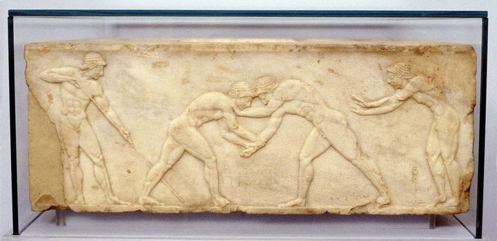 UNSPECIFIED - _ Wrestlers. Fragment of bas-relief frieze c.500 BC. The Panathenaia, a state religious festival dedicated to Athena, was held every 4 years and included Drama, Music and Athletics. Atheltic element formed Panathenaic Games, precursor of Olympic Games. Archaeological Museum of Thessaloniki (Photo by Universal History Archive/Getty Images)