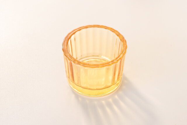 ダイソー ガラスキャンドルホルダー（クリア、オレンジ） デザイン