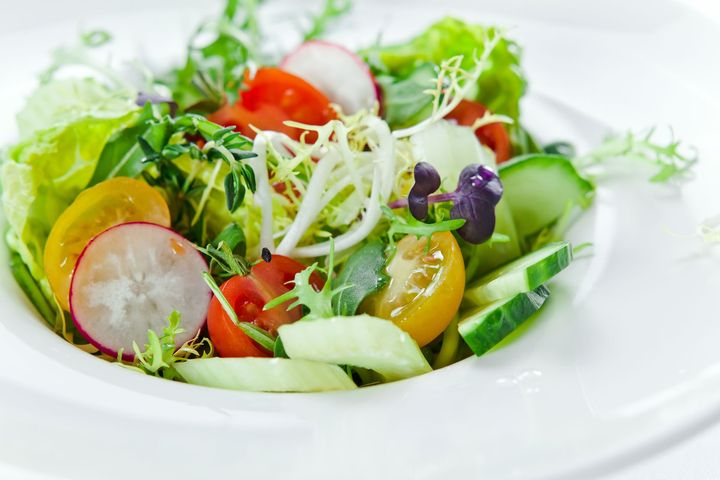 fresh salad with tomatoes, cucumber and greens