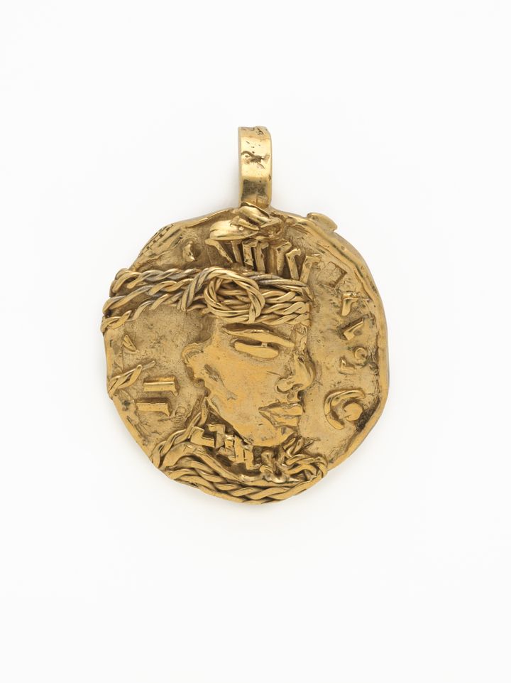 “Kalinago Royal Coin #8” pendant, Dynasty<br /> and Soull Ogun (American, born 1984) for<br /> L’Enchanteur (American, founded 2017),<br /> 2023; Courtesy L’Enchanteur.<br /> Photo © The Metropolitan Museum of Art