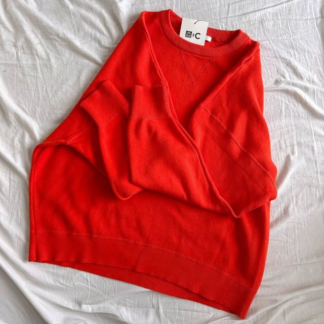 オレンジのスムースコットンクルーネックセーター