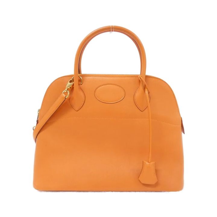 オレンジ色のエルメスのボリード