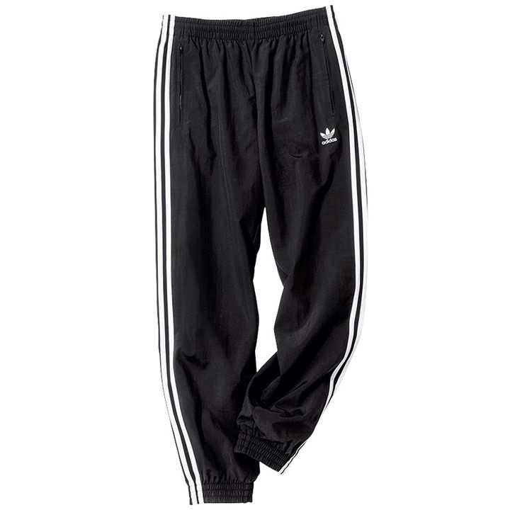 アディダスのアディカラー ウーブンファイヤーバードトラックパンツ