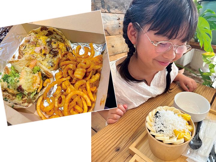 沖縄のタコスのお店のタコスとアサイーボウルを前に微笑む女の子