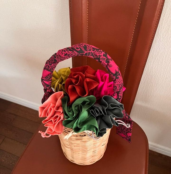 「SUTAKO369」の縦長の籠バッグ