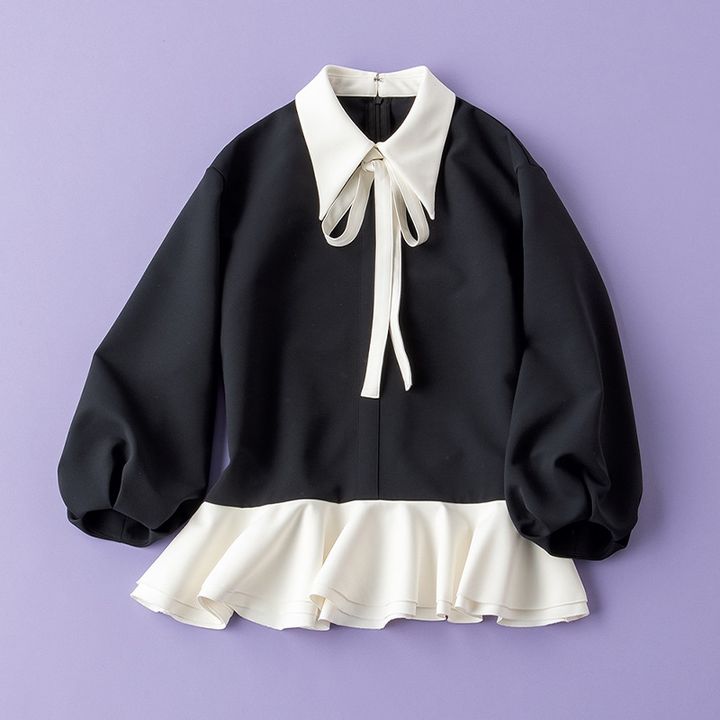 マーロンエノンフィのシャープな衿とリボンタイが特徴のブラウス