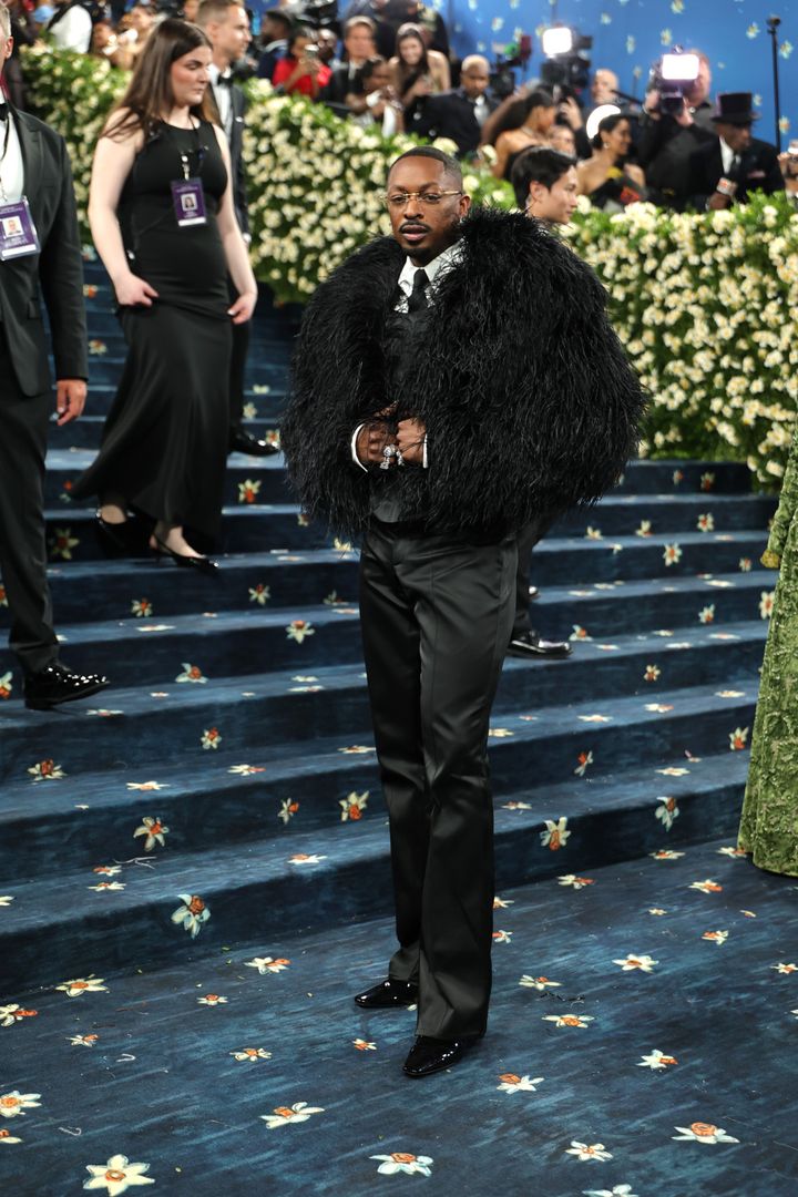 Image may contain_ Yang Jinghui, Adult, Person, Clothing, Footwear, Shoe, Formal Wear, Suit, Accessories, Tie, and Hat