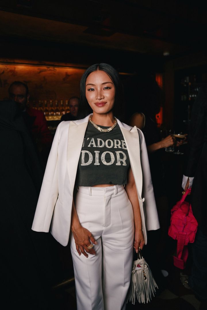 Image may contain_ Blazer, Clothing, Coat, Jacket, Accessories, Bag, Handbag, Jewelry, Necklace, Adult, Person, and Wedding