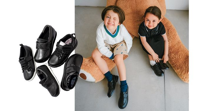 黒いレザー調の靴でおめかしする男の子と女の子