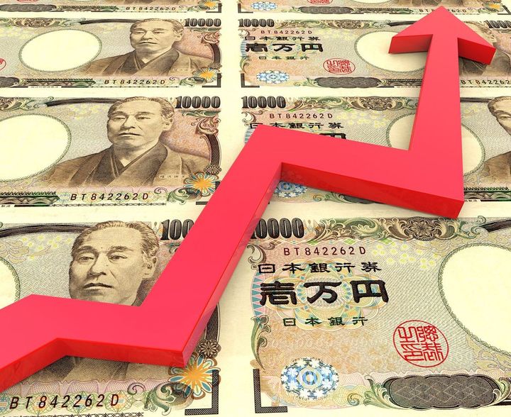 敷き詰められた1万円紙幣と上向きの矢印