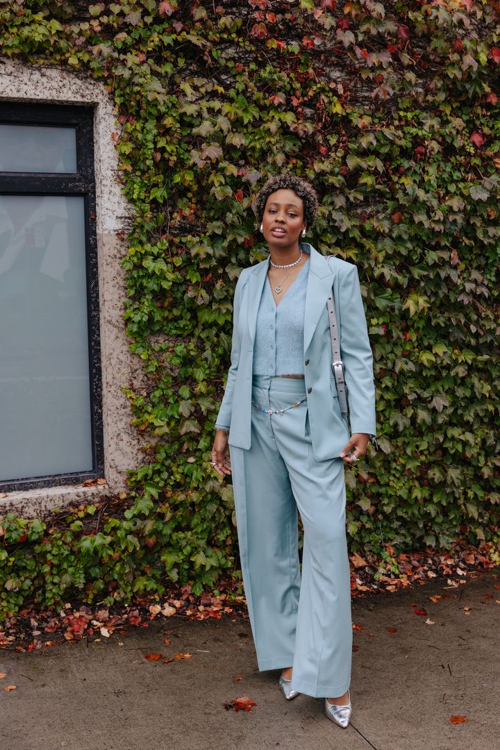 Image may contain_ Person, Standing, Adult, Accessories, Jewelry, Necklace, Clothing, Footwear, Shoe, and Coat