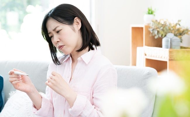 微熱がある女性
