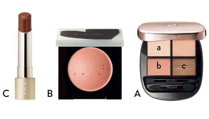 A_透明感のある発色で肌に溶け込み、目元に立体的な表情を生む。温かなコーラルベージュ。スキンシャドウ デザイニング パレット 06 ¥7,700（コスメデコルテ） B_繊細なツヤとシースルー発色で、使いやすいピーチピンク。ルミナスドーム ブラッシュ EX02 ¥3,300（セルヴォーク・限定） C_ベルベットのように自然なツヤを湛えたコッパーブラウン。ベルベットシーン リップカラー 07 ¥4,400〈セット価格〉（RMK Division）