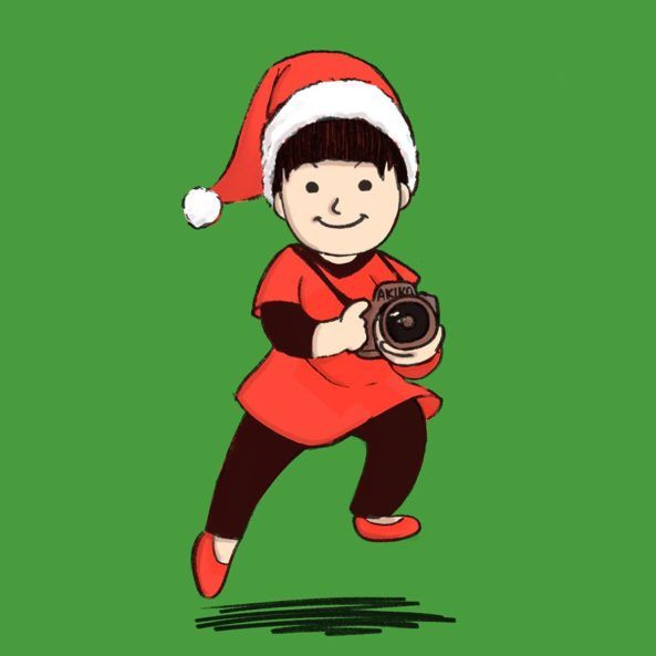 世界サンタクロース会議を撮影しているフォトグラファーの角田明子さん