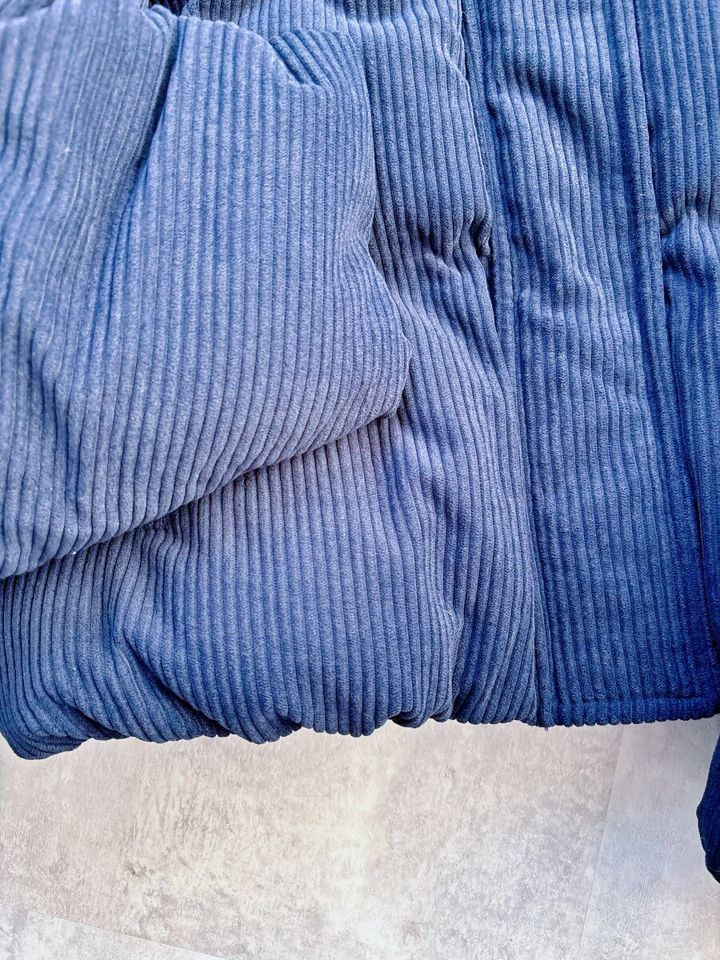 GUウォームパデッドコーデュロイブルゾン 2025モデル 裾部分