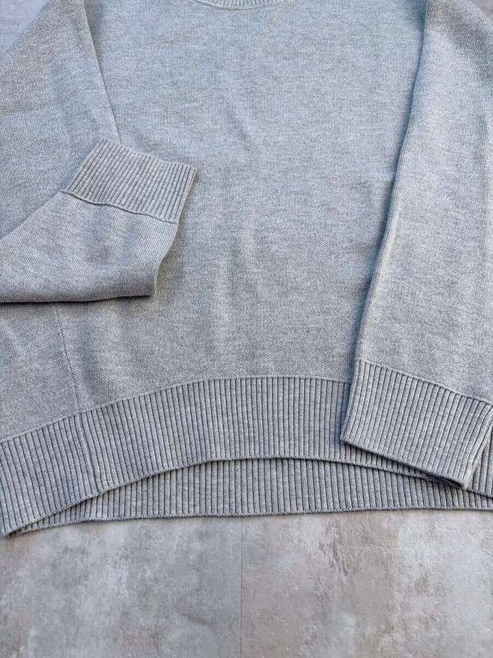 GUスウェットライクニットオーバーサイズプルオーバーのペプラムデザイン