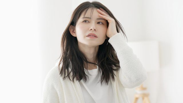 体調が悪い女性