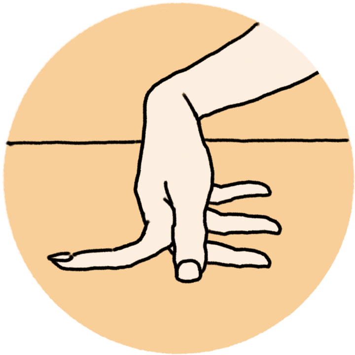 2本の指の間を開き、机などフラットな面にグイグイと押しつけてストレッチ