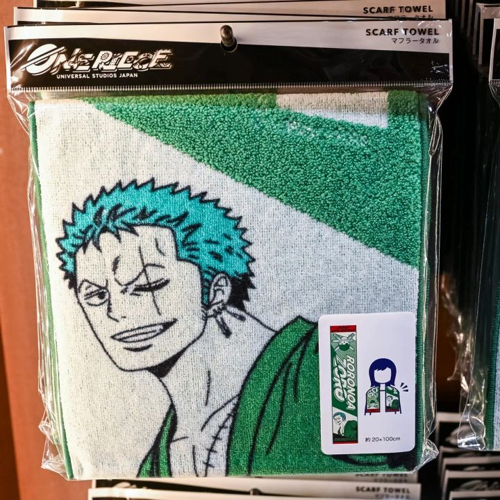 刀を携えたゾロを描いたマフラータオル