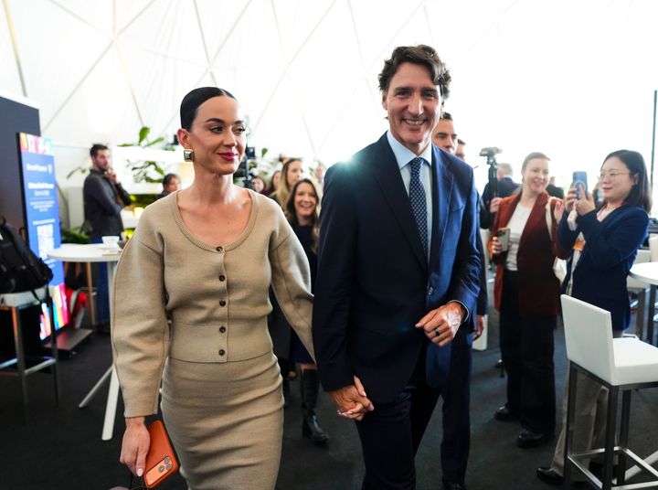 Former Prime Minister Justin Trudeau holds hands with Katy Perry as they leave an event during the World Economic Forum in Davos, Switzerland on Tuesday, Jan. 20, 2026. (Sean Kilpatrick/The Canadian Press via AP)