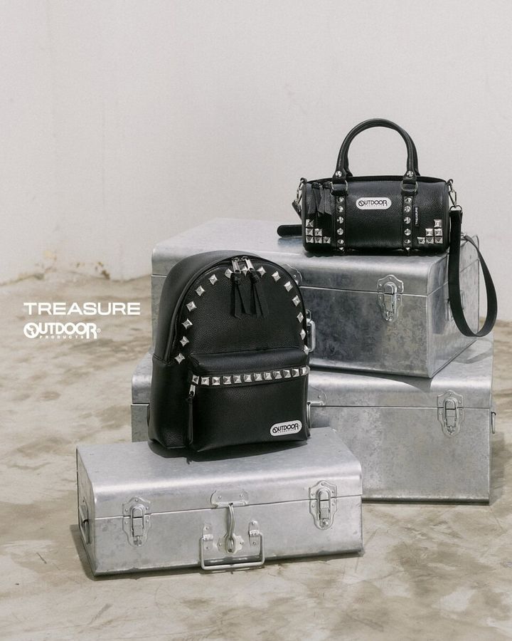 OUTDOOR PRODUCTS（アウトドアプロダクツ）が、グローバルボーイズグループTREASURE（トレジャー）との初コラボレーションを発表。デイパックとロールボストンをベースにした全6型のバッグコレクションを、2026年8月20日よりYGEX OFFICIAL SHOPおよびTREASURE Weverse Shopで発売する。
