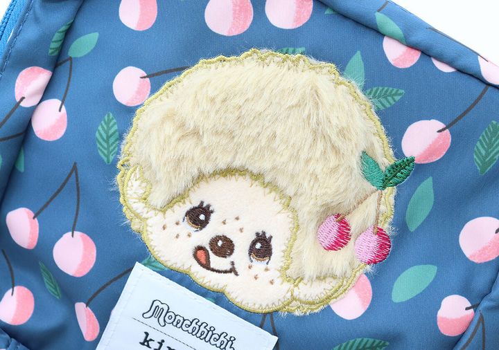 紺色ポーチのモンチッチ刺繍とさくらんぼ柄のアップ