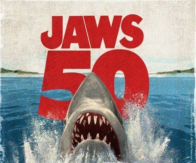 「JAWS 50」の文字とサメが海面から迫るデザイン