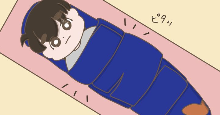 虫歯治療のためにミイラのようにがっちり固定された息子（べっこうあめアマミさん作）
