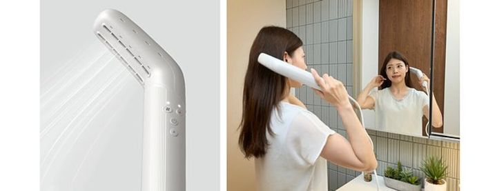 ドライヤーから風が出ている様子と、手持ちで髪を乾かす女性