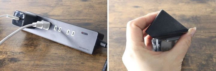 黒い電源タップに大きなACアダプターと白いプラグが挿さっている