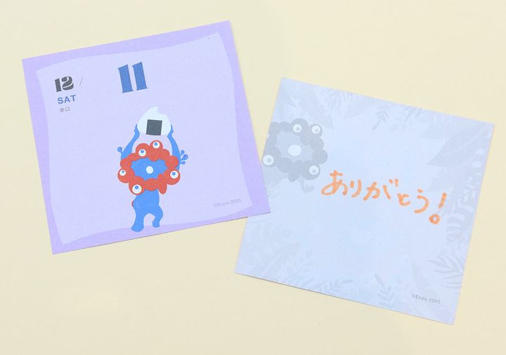 ミャクミャクが描かれた日めくりカレンダーの裏面に「ありがとう！」の文字