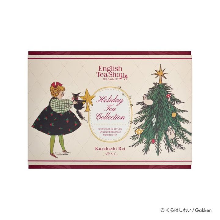 少女と黒猫がクリスマスツリーに星を飾る絵柄の、ENGLISH TEA SHOP ホリデーティーコレクションのパッケージ