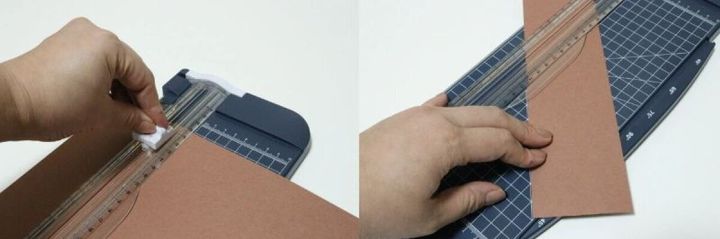 茶色い紙をペーパーカッターにセットし、スライダーでカットしている様子の2分割