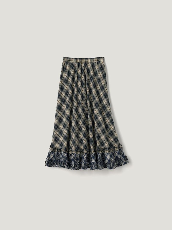 複数のチェック柄を組み合わせたフリルスカート。裾に2段フリルがあしらわれている。