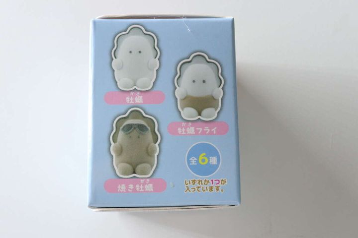 求心フレンズソフビフィギュアのパッケージ側面、牡蠣、牡蠣フライ、焼き牡蠣のイラスト