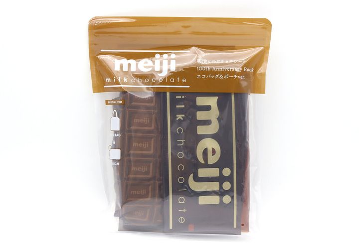 透明な袋に入った明治ミルクチョコレートのエコバッグとポーチのムック本