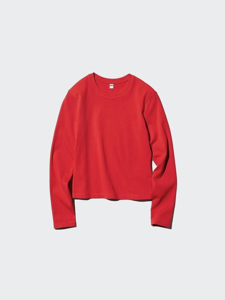 赤色の長袖ミニTシャツが平置きされている商品写真