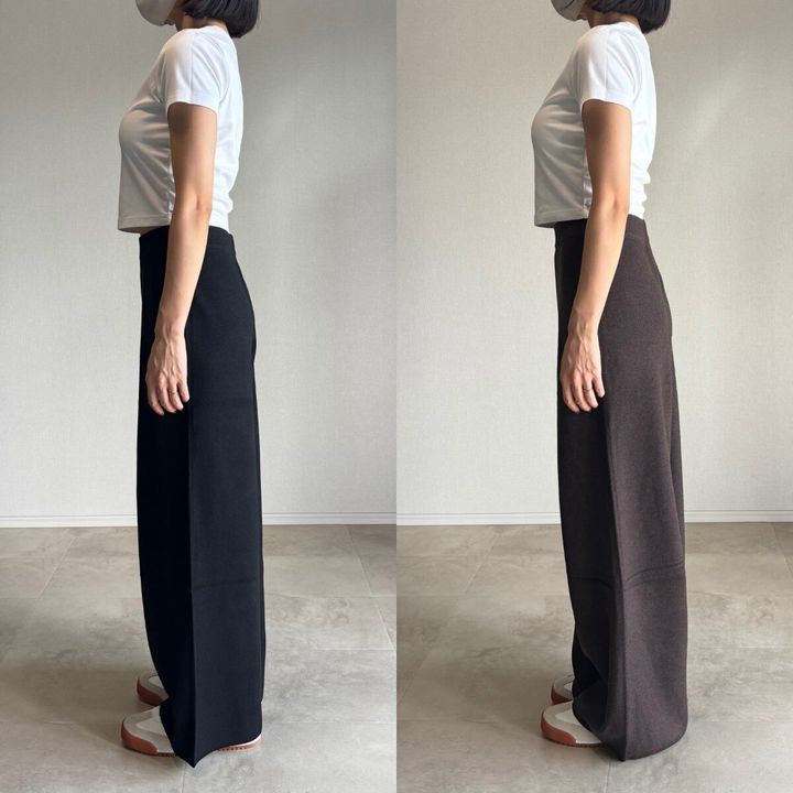 白Tシャツとブラックの標準丈、ダークブラウンの丈長めニットパンツを着用した女性の横姿