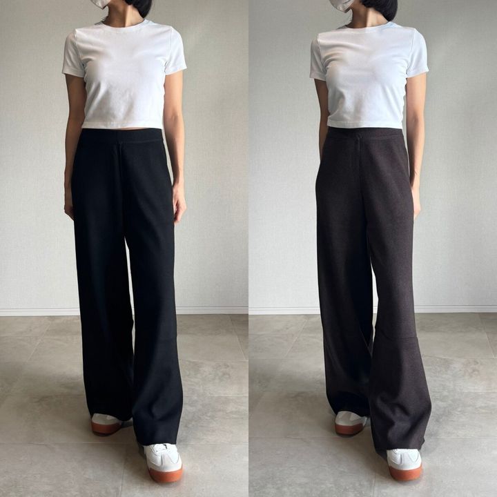 白Tシャツとブラックの標準丈、ダークブラウンの丈長めニットパンツを着用した女性